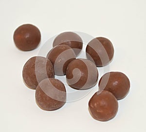 Bite size servings of unwrapped chocolate malt balls