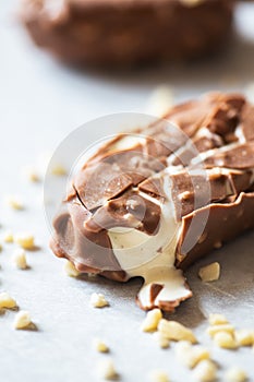 Bited almond vanilla ice-cream with chocolate glaze