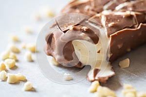 Bited almond vanilla ice-cream with chocolate glaze