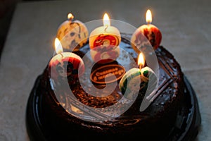 Bithday cake with pink cream and icing, sprinkled with glitter and sweets in the shape of hearts copy space.