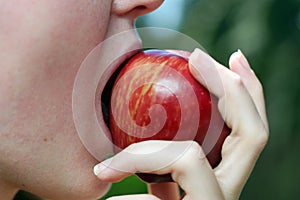 Biting apple