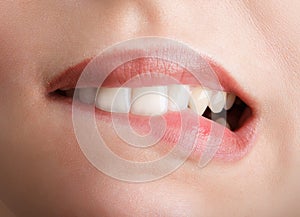 Biting her red lips teeth