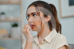 Biting, nails and woman with anxiety, stress and mental health risk at home. Scared, fear and face of nervous female