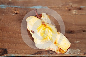 a bitten off apple on the table