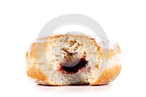 Bitten off Berliner or donut, isolated against white