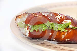 Bitten a sandwich with ham and lettuce