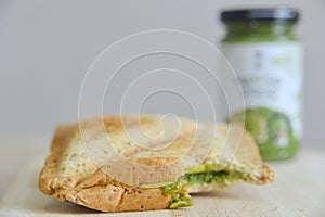 Bitten whole wheat matcha and cheese sandwich