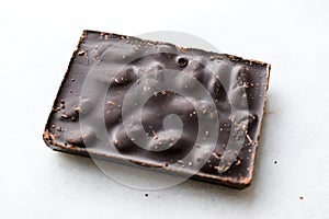 Bitter Almond Chocolate Bar on Dark Wooden Surface