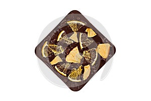 Bitter chocolate bar with dried orange and apple flakes isolated on white background. Luxury handmade chocolate