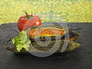 Bitter cucumber stuffed with tomatoes