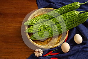 Bitter gourd and egg on the table