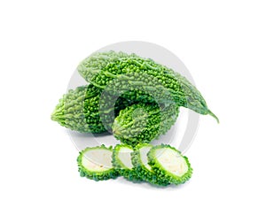 Bitter gourd pile and piece on white background. vegetable herb Nourish the health body