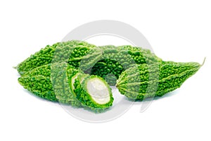 Bitter gourd pile and piece on white background. vegetable herb Nourish the health body