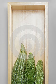 Bitter melon in a wooden box