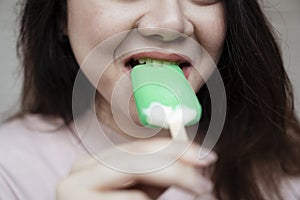 Bitting ice cream, close up shot