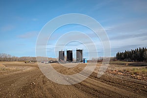 Bitumen oil storage tanks on an oil lease