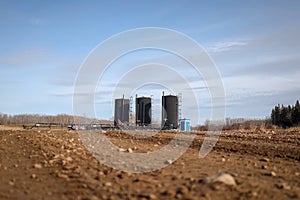 Bitumen oil storage tanks on an oil lease