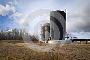 Bitumen oil storage tanks on an oil lease