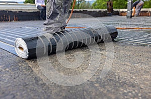 Bituminous membrane waterproofing system details and installation on flat rooftop