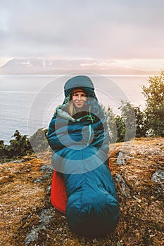 Bivouac outdoor woman in sleeping bag camping gear travel vacations girl hiking solo active tourist exploring Norway
