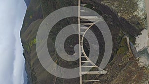 Bixby Creek Bridge and Pacific Ocean. Big Sur, California, USA. Aerial View. Vertical Video