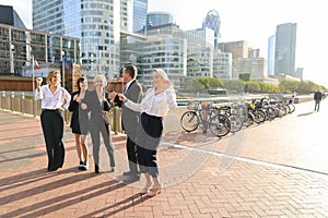 Biz team members shaking hands in La Defense Paris, .