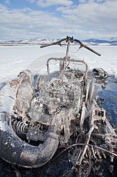 Bizarre burnt out snowmobile on Yukon lake Canada