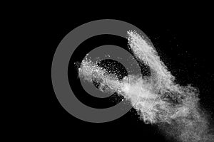 Bizarre forms of of white powder explosion cloud against dark background.Launched white dust splash on black background