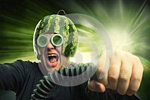 Bizarre man in a helmet from a watermelon photo