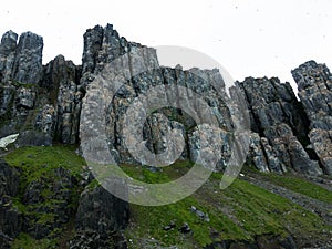 Bizarre rock formation. Alkefjellet, one of the largest and most spectacular bird cliffs on Svalbard.