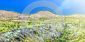 Bizarre rock formations of volcanic Tuff and basalt on soft sunlight in Cappadocia, Turkey