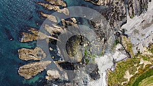 Bizarre rocks on the coastland. Top view of the rocks of the Celtic Sea