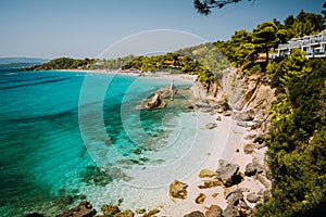 Bizarre rugged white rock cliffs near famous beach of Platys and Makrys gialos with pure clear turquoise sea water