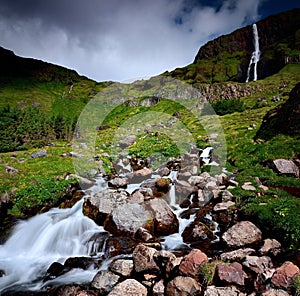 Bjarnafoss waterall falling over the mountain edgetryside