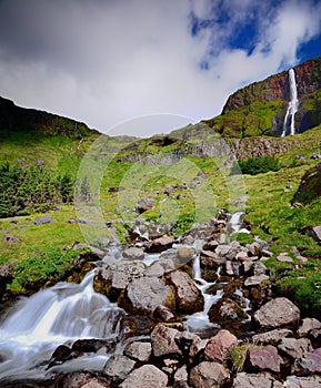 Bjarnafoss waterall falling over the mountain edgetryside
