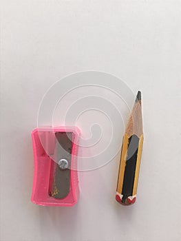Sharpener and tiny pencil. Close view.