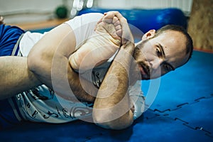 BJJ Brazilian jiu-jitsu ground sparing. Leg ankle foot lock submission