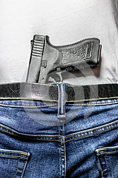 Black 9mm in waistband view from behind