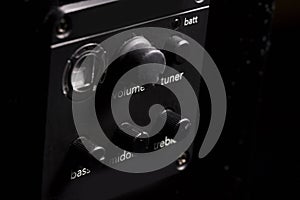 black acoustic guitar,tone stack, tone control, equalizer, close-up