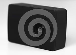 Black action camera, isolated on grey background