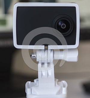 Black action camera, isolated on grey background