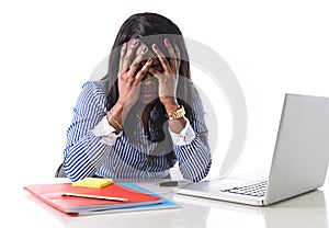 Black African American ethnicity stressed woman suffering depression at work photo