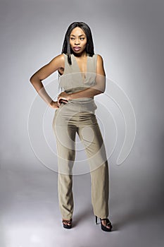 Black African American Fashion Model Wearing a Gray Jumpsuit
