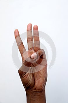 Black African indian hand showing number three