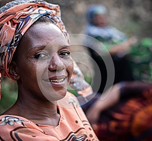 Black African senior beautiful woman with scarf outdoors portrait