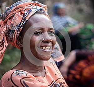Black African senior beautiful woman with scarf outdoors portrait
