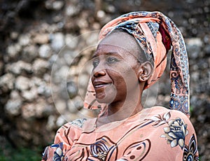 Black African senior beautiful woman with scarf outdoors portrait