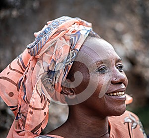 Black African senior beautiful woman with scarf outdoors portrait