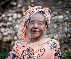 Black African senior beautiful woman with scarf outdoors portrait