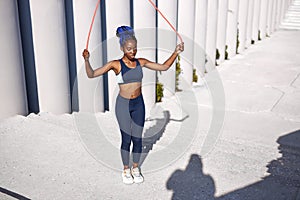 Black african woman jump rope